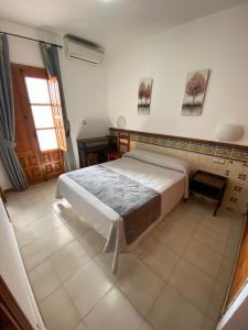 Posteľ alebo postele v izbe v ubytovaní Hotel Simón