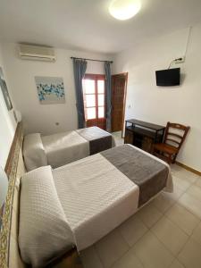 Posteľ alebo postele v izbe v ubytovaní Hotel Simón