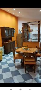 a kitchen with a table and chairs in a room at Casa Vacanza via Annarita Sidoti in Porto San Giorgio
