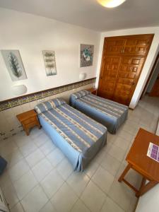 Posteľ alebo postele v izbe v ubytovaní Hotel Simón
