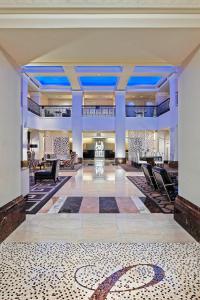 a large lobby with chairs and a rug on the floor at The Lexington Hotel, Autograph Collection in New York