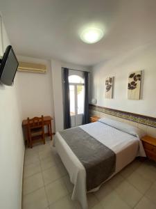 Posteľ alebo postele v izbe v ubytovaní Hotel Simón