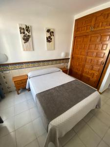 Posteľ alebo postele v izbe v ubytovaní Hotel Simón