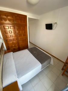Posteľ alebo postele v izbe v ubytovaní Hotel Simón