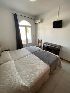 Posteľ alebo postele v izbe v ubytovaní Hotel Simón