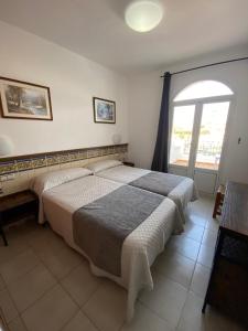 Posteľ alebo postele v izbe v ubytovaní Hotel Simón