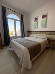 Posteľ alebo postele v izbe v ubytovaní Hotel Simón