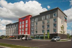 a rendering of a building with cars parked in a parking lot at TownePlace Suites by Marriott Ottawa Kanata in Ottawa