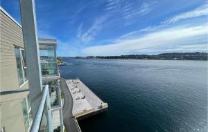 a balcony of a building with a view of the water at 3 Bedroom Beautiful Apartment In Haugesund in Haugesund