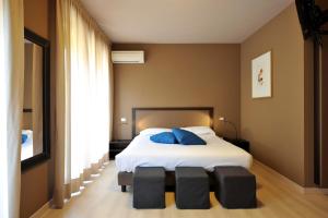 Postel nebo postele na pokoji v ubytování M14 Hotel & Spa