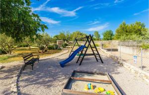 a playground with a slide and a swing set at Lovely Home In Jadrija With Wifi in Jadrija