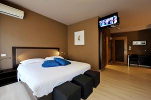 Postel nebo postele na pokoji v ubytování M14 Hotel & Spa