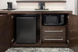 a kitchen with a microwave and a small refrigerator at Courtyard by Marriott San Diego Downtown in San Diego