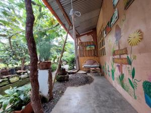 a hallway of a house with a mural on the wall at Cabañas Maná in San Juan La Laguna