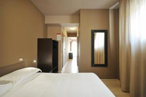 Postel nebo postele na pokoji v ubytování M14 Hotel & Spa