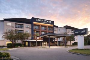 a view of a hotel with a building at Courtyard by Marriott Myrtle Beach Broadway in Myrtle Beach