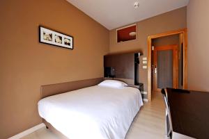 Postel nebo postele na pokoji v ubytování M14 Hotel & Spa