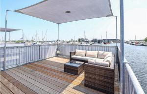 a couch on the deck of a boat at Aqualiving in Aalsmeer
