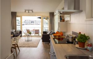a kitchen and living room with a view of the ocean at Aqualiving in Aalsmeer