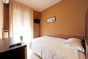 Postel nebo postele na pokoji v ubytování M14 Hotel & Spa