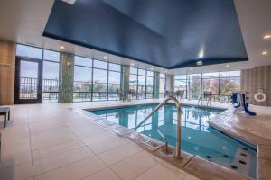 a large swimming pool in a hotel room at Fairfield by Marriott Denver Downtown in Denver