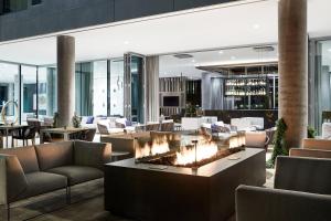 a lobby with a fire pit in a building at AC Hotel Phoenix Biltmore in Phoenix