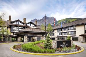 a hotel with a sign in front of a building at Kananaskis Mountain Lodge, Autograph Collection in Kananaskis Village