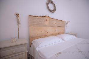 מיטה או מיטות בחדר ב-Dimora Spierti