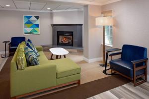 a living room with a couch and a fireplace at Residence Inn by Marriott Tysons in Tysons Corner