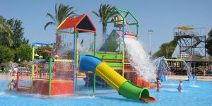 a water park with a slide in the water at Torri apartments - 3 mins walk to beach in Torrevieja