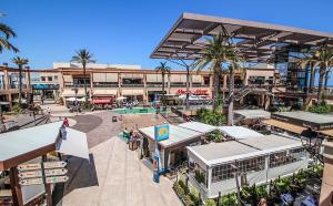 an overhead view of a shopping mall with palm trees at Torri apartments - 3 mins walk to beach in Torrevieja