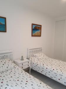 Postel nebo postele na pokoji v ubytování El piso de Valle-Inclán