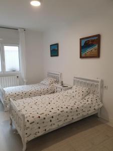 Postel nebo postele na pokoji v ubytování El piso de Valle-Inclán