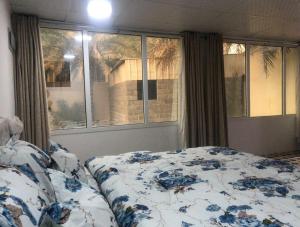 Postel nebo postele na pokoji v ubytování Haret Nizwa hostel