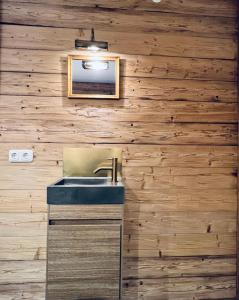 a bathroom with a sink and a mirror at Ferienwohnung Lechraum in Waal in Waal