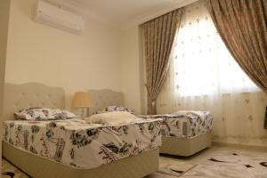 Postel nebo postele na pokoji v ubytování İhsan villas
