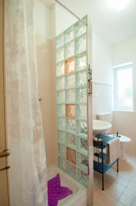 a bathroom with a shower and a sink at B&B Duino Stella Maris in Duino