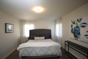 a bedroom with a large bed in a room at Grand Spanish 3BD 2BA near West Hollywood and Beverly Hills in Los Angeles
