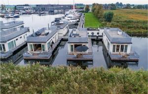 a group of boats are docked in a marina at 2 Bedroom Cozy Ship In Aalsmeer in Aalsmeer