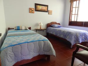 Giường trong phòng chung tại Villa del Moján