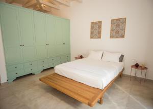Ένα ή περισσότερα κρεβάτια σε δωμάτιο στο Aeonian Villa Ermioni