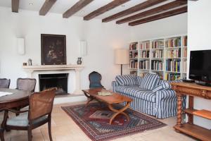 a living room with a couch and a table at Ferienhaus in der Sonne in Bad Hindelang