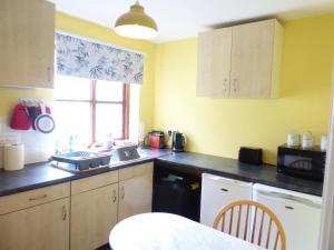 a kitchen with a sink and a counter top at The Catkins, Grove flock farm in Diss