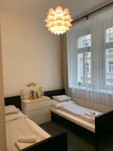 Posteľ alebo postele v izbe v ubytovaní Little Tom Apartments + 37 fotografií