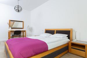 Posteľ alebo postele v izbe v ubytovaní DreamHouse Apartament „Laguna” ul. Wschodnia 12, Darłówko Wschodnie