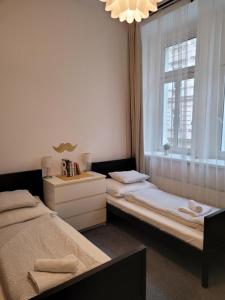 Posteľ alebo postele v izbe v ubytovaní Little Tom Apartments