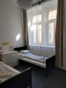 Posteľ alebo postele v izbe v ubytovaní Little Tom Apartments