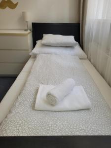 Posteľ alebo postele v izbe v ubytovaní Little Tom Apartments