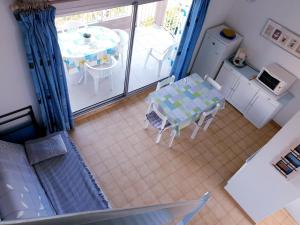 Kuchyňa alebo kuchynka v ubytovaní GRENADINES Joli appartement piscine proche Plage Richelieu Cap d'Agde