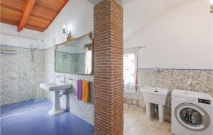 a bathroom with a sink and a washing machine at Villa Altea in Itri